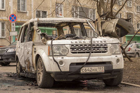 Moscow, Russia - April 15, 2022: burned out Land Rover car on the street. Based on the nature of the fire, hood torn from the inside and preserved tires, cause was an electrical short circuit.のeditorial素材