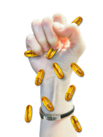 Human fist with omega3 pillsの写真素材