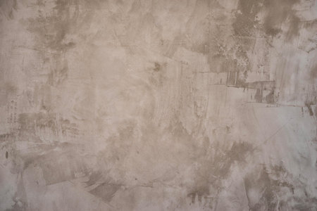 Neutral dark gray texture of a cement wall with beautiful spatula stainsの写真素材