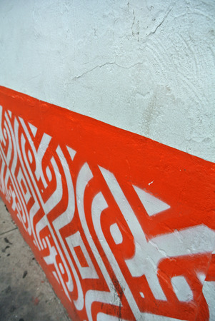 white wall with orange decorationsの写真素材