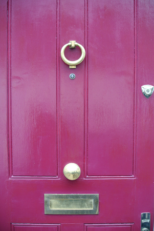 detail of pink door with letterbox,の写真素材