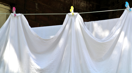 white clothes hanging out to dryの写真素材