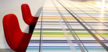 red chairs and table decorated with colored lines