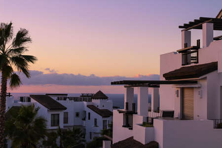 White houses in the sunset light on a pink sky background. Tenerife Spain.の写真素材