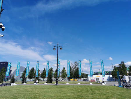 Flags in front of the entrance to the Gazprom Arena stadium in St. Petersburg on the morning of the...