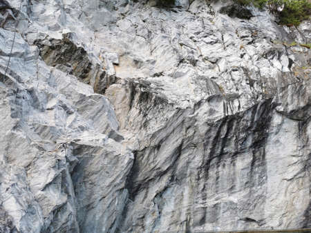 A view from below of the marble section of the Marble Canyon in the Ruskeala Mountain Park on a sunny summer day.の写真素材