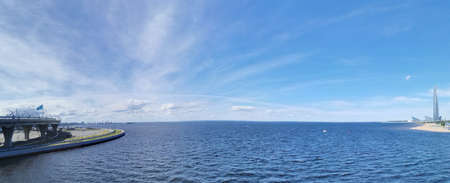 Panorama from the bridge with a view of the Gulf of Finland, Lakhta Center, the studio of the Match TV channel in the park of the 300th anniversary of St. Petersburgの写真素材