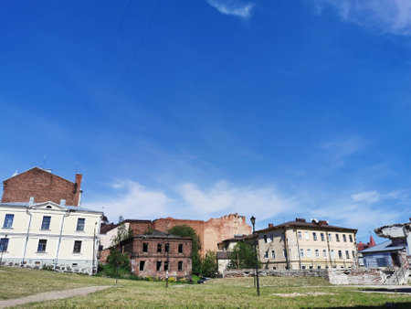 Old, partially destroyed houses, on a sunny summer day in Vyborg.