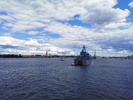 View from the bridge of a warship and sailboats in the Neva water area for the Day of the Navy in...
