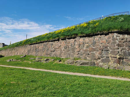The wall of the Panzerlaks Bastion, built in the 16th century, in the city of Vyborg on a clear summer day.の写真素材