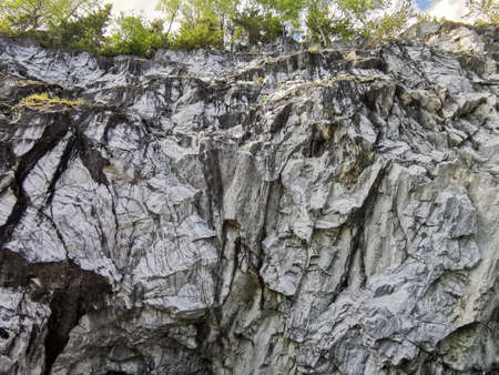 View from the water on the steep slope of the flooded Marble Canyon in the Ruskeala Mountain Park on...