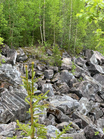 Marble boulders left over from marble mining in the Ruskeala Mountain Park on a sunny summer day.の写真素材