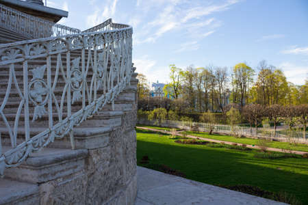 A fragment of an openwork staircase leading to the gallery of the Catherine Park and a view of the Park itself. There are no people.の写真素材