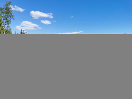 View from the observation deck of the turquoise water of the Marble Canyon in the Ruskeala Mountain Park with the reflection of the sky and trees on a sunny summer day.の写真素材