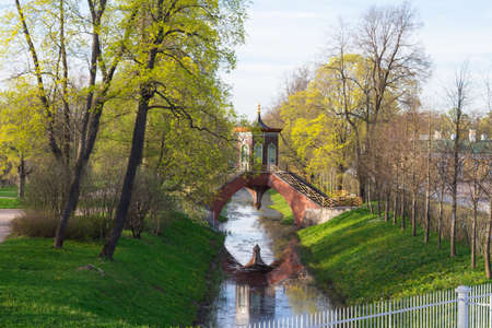 Cross the bridge to the pavilion over the Krestovy canal in the Alexander Park.の写真素材