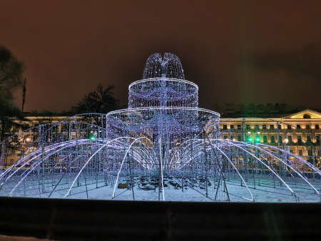 A fountain of garlands made for Christmas and New Year in the Alexander Garden of St. Petersburg on an early winter morning.の写真素材