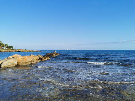 Protaras. Famagusta area. Cyprus. The coast of the Mediterranean Sea, a stone ridge, at the end of...