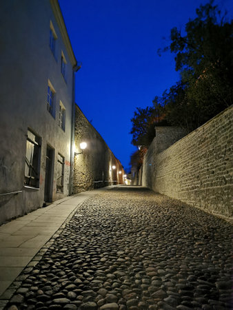 One of the narrow, cobbled streets of Old Tallinn against the blue sky. spring evening. Wanalynn area.の写真素材