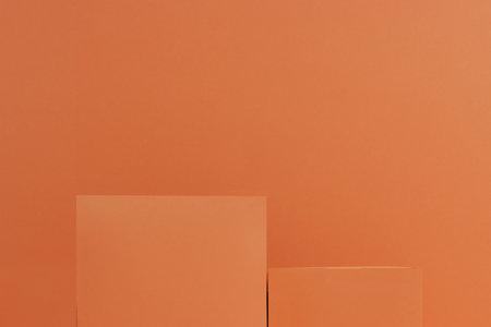 empty two square podium for design, product on orange background.の写真素材
