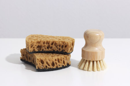 Zero waste cleaning products and dish washing brushes on white background. Concept Eco-friendly, natural laundryの写真素材