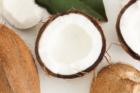 Fresh coconut on white background. Home spa treatment concept, organic cosmetic. Close upの写真素材