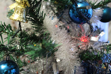 Christmas tree and decorations , toys and a luminous garlandの写真素材