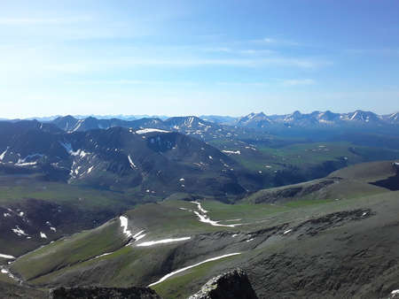 beautiful mountains of the Northern Urals with snow in summerの写真素材