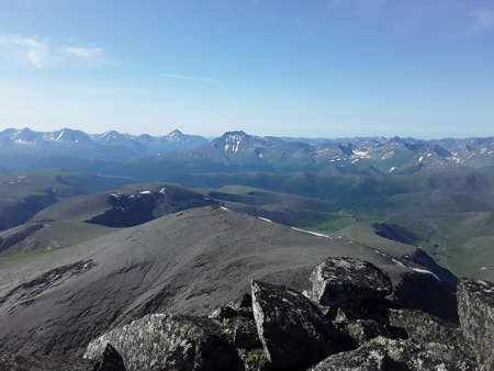 beautiful mountains of the Northern Urals with snow in summerの写真素材