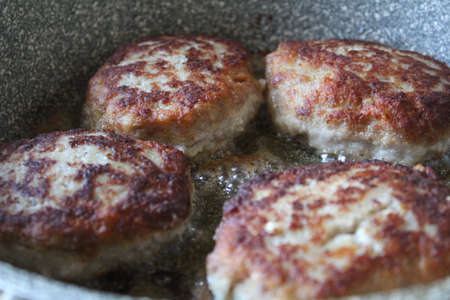 pork cutlets are fried in the kitchenの写真素材