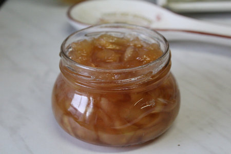 Jam in glass jar on the table, closeup of photo.の写真素材