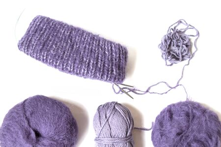 Purples yarn balls on the white background. Isolated objects. Top view. Flat layout. Knitting with pleasure. Future hat.の写真素材