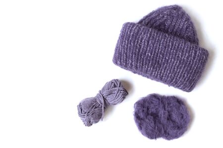 Knitted woolen hat and yarn balls on the white background. Top view. Flat layout. の写真素材
