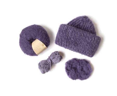 Knitted woolen hat and yarn balls on the white background. Top view. Flat layout. の写真素材