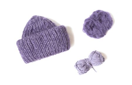 Knitted hat on the white background. Woolen yarn balls. Top view. Flat layout. の写真素材