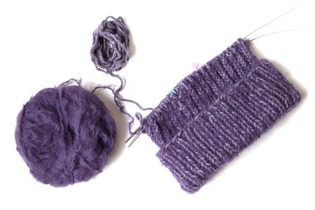 Purples yarn balls on the white background. Isolated objects. Top view. Flat layout. Knitting with pleasure. Future hat. の写真素材