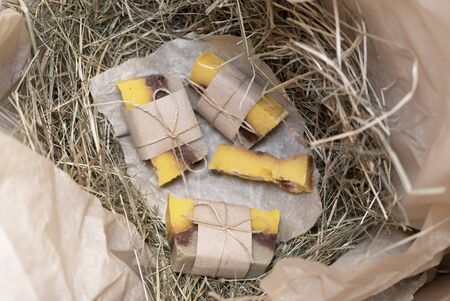 Hand made soap on the dry grass in the box