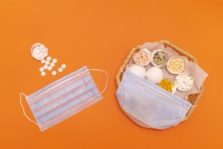 Easter and coronovirus. Colorful eggs with pills.の写真素材