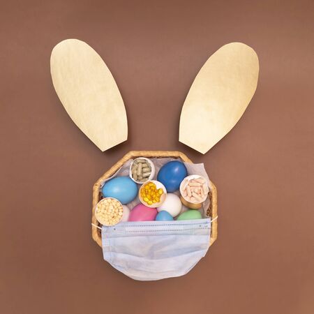 Easter and coronovirus. Colorful eggs with pills.