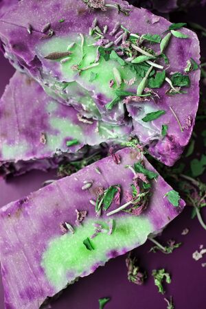 Hand made lavender soaps on the blue background. Natural cosmetic. Home business. Voluntary Isolation. Zero wasteの写真素材