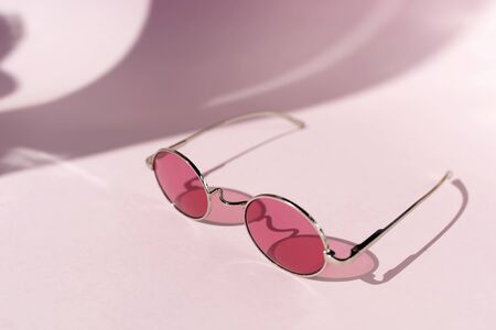 Pink glasses and shadowsの写真素材