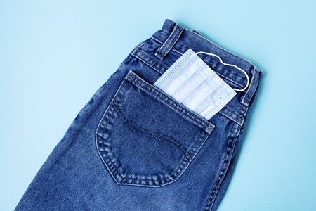 Blue background with blue jeans. Coronavirus concept.の写真素材