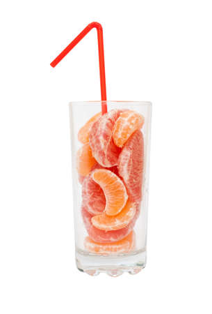 Grapefruit and tangerine slices in a glass with a strawの写真素材