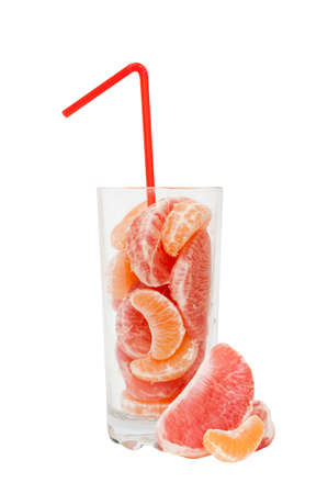 Grapefruit and tangerine slices in a glass with a strawの写真素材