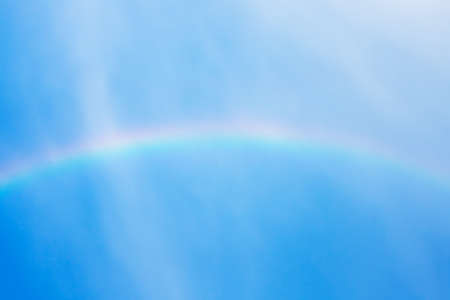Beautiful rainbow in blue sky after the rainの写真素材