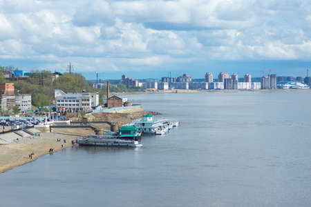 KHABAROVSK, RUSSIA - MAY 7, 2014: Embankment of the Amur River with new buildings and pleasure boatsのeditorial素材