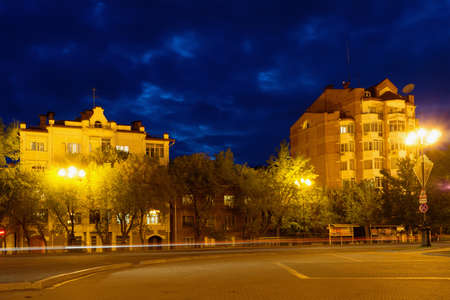 KHABAROVSK, RUSSIA - MAY 16, 2014: One of the streets at night. Long exposure. Trace of car headlightsのeditorial素材