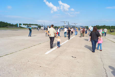 TVER, RUSSIA - AUGUST 16, 2014: People walk between the planes at the open day at the aerodrome Migalovoのeditorial素材