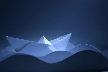 Paper Boat on paper wavesの写真素材