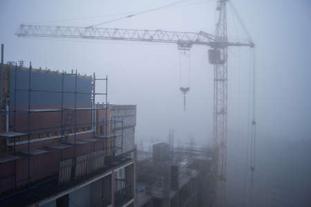 Construction site in the morning fogの写真素材