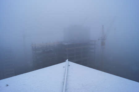 Construction site at the morning fogの写真素材